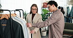 Fashion, choice and stylist with customer in boutique, shopping and discussion for outfit selection. People, talking and assistance for client, consultation and advice for clothing decision in store