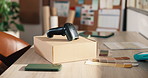 Office, box and scanner at startup for ecommerce, logistics and color palette for fashion launch. Barcode, parcel or sample in workplace with pc, clothes collection and online retail for distribution