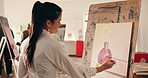 Artist, woman and painting on canvas in class to practice skill, drawing and creative process. Painter, art and person with brush stroke for artistic pot, artwork inspiration or talent in studio