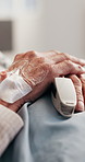 Medical, old person or hands with pulse oximeter, heart rate track or oxygen level in hospital. Space, tech or senior patient with monitoring, respiratory assessment or SpO2 vital sign in healthcare.