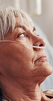 Sick, thinking and old woman in hospital with oxygen tube, respiratory infection and rehabilitation. Senior person, rest and reflection in clinic with breathing equipment, lung disease and fatigue.