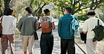 College, education and walking with friends, outdoor and conversation with group and laugh together. Back, students and funny discussion with happy people, bonding and travel on university campus