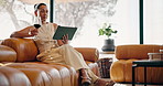 Woman, tablet and drink with wine glasses in home for online platform, streaming or entertainment. Female person, relax and alcohol with technology on sofa for subscription app or network in house