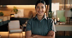 Face, woman and massage therapist with arms crossed at spa, about us or holistic healing experience. Portrait, happy person and worker with therapy service, confident professional and luxury resort