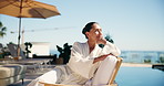 Thinking, woman and relax at resort for travel, enjoy sunshine and daydreaming on summer holiday. Thoughts, mature person and unwind outdoor with happiness, calm morning and vacation at accommodation
