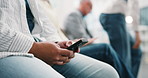 Hands, person and phone in waiting room at hospital, appointment and health survey for consultation. People, queue or mobile at clinic for checkup, application form and patient history for healthcare