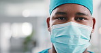 Face mask, surgeon and man in clinic for healthcare, wellness and safety compliance. Portrait, medical professional and hygiene with space, scrubs and surgery employee for support in hospital