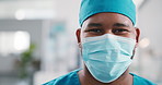 Face mask, surgeon and man in clinic for hygiene, wellness and safety compliance. Portrait, medical professional and healthcare with space, scrubs and surgery employee for support in hospital