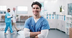 Face, nurse and happy man in clinic with confidence for medical career, wellness service and values. Male person, healthcare worker and arms crossed in hospital with trust, integrity and smile
