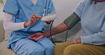 Home, nurse and senior woman with blood pressure test, machine and consulting for medical service. Healthcare, retirement and caregiver with health exam for hypertension, checkup and patient support