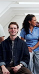 University students, face and laughing with group, education and bonding with friends in classroom. Confident, portrait and happy people on break, knowledge and scholarship for studies in college