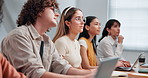 Listening, presentation and students in college for notes, feedback and lesson for assignment. University, class and people with books, tech and writing for education, learning and oral assessment