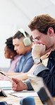 University student, thinking and man with tablet, education or planning for assignment in classroom. College, notes and person with tech, writing and exam preparation with information on website