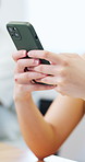 Person, hands and typing with phone for communication, social media or network connection in home. User, texting or chatting with mobile app or internet for online software, update or review in house