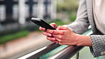 Business, text or hands on balcony with phone, funding request or online chat on portfolio update. Contact, person or finance advisor outdoor with tech, investment inquiry or feedback on asset status