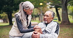 Fitness, knee pain and old couple at park with arthritis, stiff bones and accident outdoor. Senior man, woman and help or support for joint problem, muscle or leg injury and interracial relationship