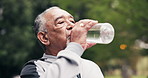 Senior, man and fitness with water in park for hydration, workout break or outdoor recovery. Active, elderly or male person with mineral liquid, drink or thirst for nutrition, rest or sustainability
