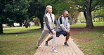 Fitness, exercise and old couple stretching at park for workout, healthy lifestyle and warm up. Senior man, woman and together outdoor for retirement wellness, happy and interracial relationship