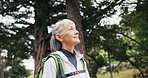 Senior, happy woman and thinking in woods for hiking adventure, scenic break and explore nature. Fresh air, pensioner or trekking in forest with reflection, sightseeing or healthy aging with backpack