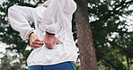 Hiking, hands or old woman in nature with back pain, joint injury or burnout in fitness activity. Discomfort, bokeh or senior person with massage, wellness risk or spine strain in retirement trekking