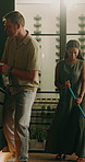 Cleaning, happy and couple with music in home for chores, housekeeping and hygiene on weekend. Marriage, love and man with woman with spray bottle, mop and dust for maintenance, housework and bonding