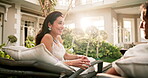 Couple, talking and relax with wine, resort and laugh with partner and bonding together on holiday. Flare, hospitality and happy mature people with alcohol, connection or funny discussion on vacation
