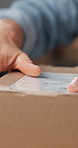 Person, hands and box with label for logistics, delivery instruction or shipping information. Closeup, distributor or supplier with sticker, parcel or package for online transportation in store