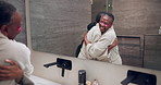 Senior, mom and adult daughter in spa with eye patches for skincare, beauty or bonding day together. Elderly, mother and black woman with smile, hug or reflection for cosmetics in bathroom salon