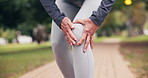 Senior, person and hands with knee pain for outdoor injury, discomfort or muscle tension on path. Active, elderly or sore leg with massage for joint inflammation, overworked strain or fibromyalgia