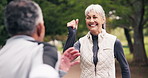 Fitness, exercise and old couple marching at park for cardio workout, healthy lifestyle and walking. Senior man, woman and together outdoor for retirement wellness, happy and interracial relationship