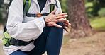 Hiking, hands or old woman in nature with knee pain, joint injury or burnout in fitness activity. Discomfort, tension or senior person with massage, wellness risk or leg strain in retirement trekking