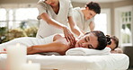 Peace, couple or woman in spa with massage, comfortable rest or soothing benefits in wellness center. Tranquil, masseuse or people with back rub, calm treatment or tension release on romantic retreat