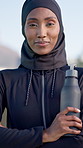 Face, muslim and black woman in city for fitness, exercise and sports training for morning routine. Portrait, islamic and person in nature with water bottle, smile and sprinting workout for wellness