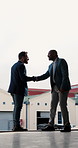 Business, men and handshake outdoor with architect, b2b and partnership for architecture project. Smile, people and shaking hands at factory for teamwork, negotiation and agreement on building design
