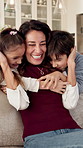 Happy, mother and hug in home with children, connection and family love bonding together on weekend. Woman, kids and embrace in living room with security, affection and quality time for wellness.