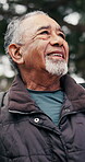 Senior, happy man and thinking in forest for hiking adventure, scenic break and nature appreciation. Fresh air, pensioner or trekking pause in woods with calm reflection, sightseeing or healthy aging