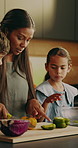 Mother, children and cooking at house with vegetables, meal prep and salad recipe for thanksgiving. Woman, kids and helping in kitchen with ingredients, culinary skills and homemade lunch for festive