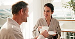 Couple, smile and toast with tea at spa, beverage and conversation on anniversary getaway. Cheers, talking and herbal drink with mature people in relationship, bonding and happy on trip at resort