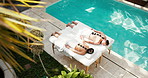 Couple, relax and back at spa with stones, muscle stiffness and heat treatment of deep tissue. Above, people and warm rocks at resort for physical therapy, improve circulation and therapeutic massage