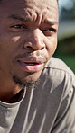 Tired, man and breathing in city with fitness challenge, thinking and recovery from running exercise. Exhausted, black person and runner outdoor with cardio workout break, wellness and fatigue.
