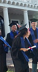 Smile, students and walk with diploma at graduation, ceremony and certificate of degree completion. Excited, people or celebrate at campus with accolade, academic success and award for learning goals