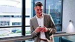 Happy, phone and business man in lobby for networking, social media and check email communication. Corporate, finance and person on cellphone for connection, internet and chat for contact in office