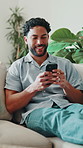 Laugh, phone and man on sofa with text message, online communication and comic post on social media. Happy, digital and person in home with technology, funny conversation or meme reaction on chat app