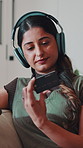 Phone, credit card and woman in house with headphones, music and streaming service renewal. Debit, mobile banking and happy person with payment, subscription or audio membership discount in home