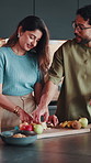 Couple, breakfast and cooking in kitchen with fruit, discussion and bonding together with healthy diet. Happy, married people and talk in home with meal prep, nutrition and banana for ingredients.