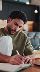 Writing, notes and man on laptop for remote work, research and planning for website traffic. Home, freelancer and person with notebook for web analytics, seo report and kpi analysis on computer