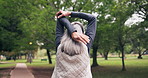 Fitness, stretching and senior woman at park for injury prevention, blood circulation and wellness. Back, person or and warm up arms in nature for exercise preparation, health benefits or retirement