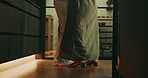 Couple, legs and dancing in home, fun and bonding with partner on special day and movement together. Anniversary, celebration and people with playful relationship, love or rhythm with spouse in house