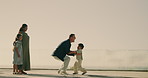 Family, dad and lifting up with child in nature for greeting, excitement or outdoor bonding together. Happy, mom and father with applause, kids or pickup for first walking or running steps on space