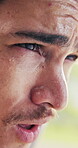 Tired, athlete and man with sweat, outdoor and thinking after physical activity or exercise at park. Exhausted, runner and person with fatigue on break, reflection or breathing post workout in nature